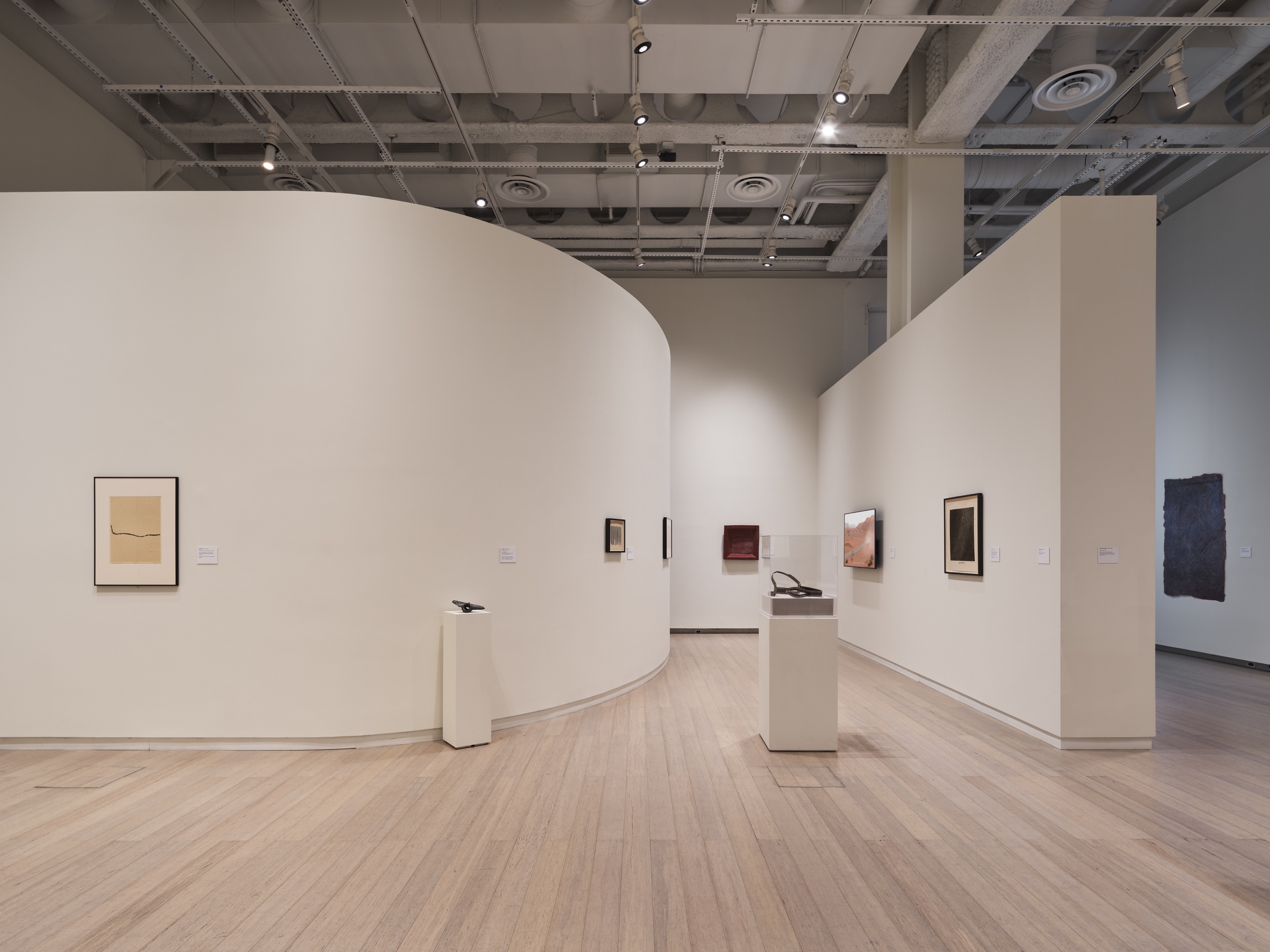 Wide installation view of Mapping Otherwise at the Wallach Art Gallery