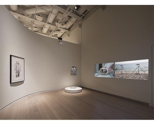 Installation view of Mapping Otherwise at the Wallach Art Gallery, with Naiza Khan’s vest sculpture and video projections